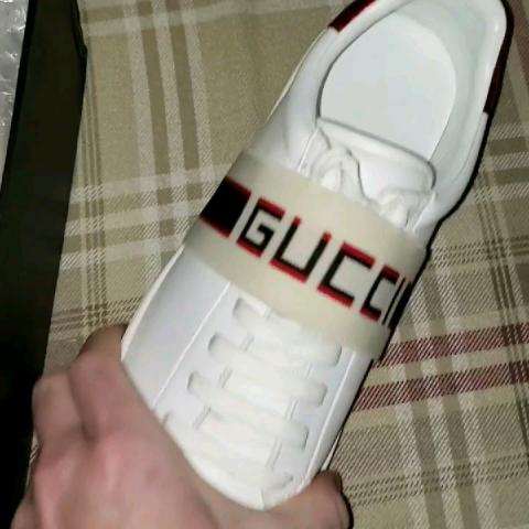 gucci stripe leather sneaker on feet