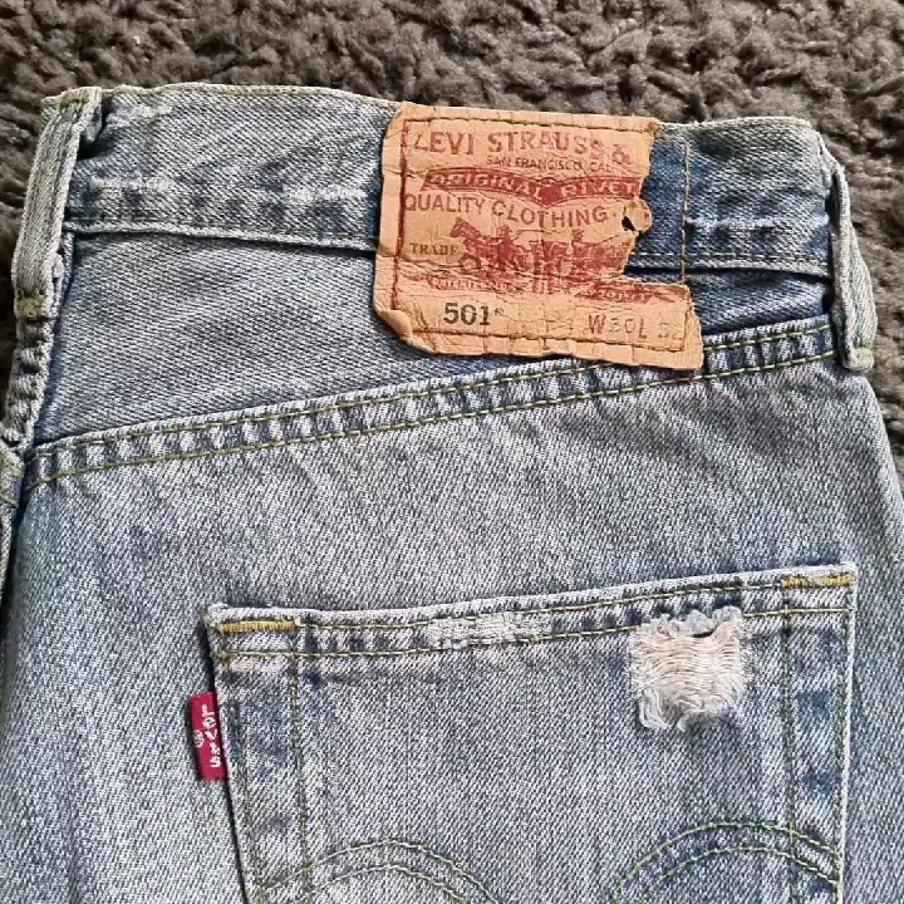 Original levi 501 ripped jeans. Badge is torn on one... - Depop