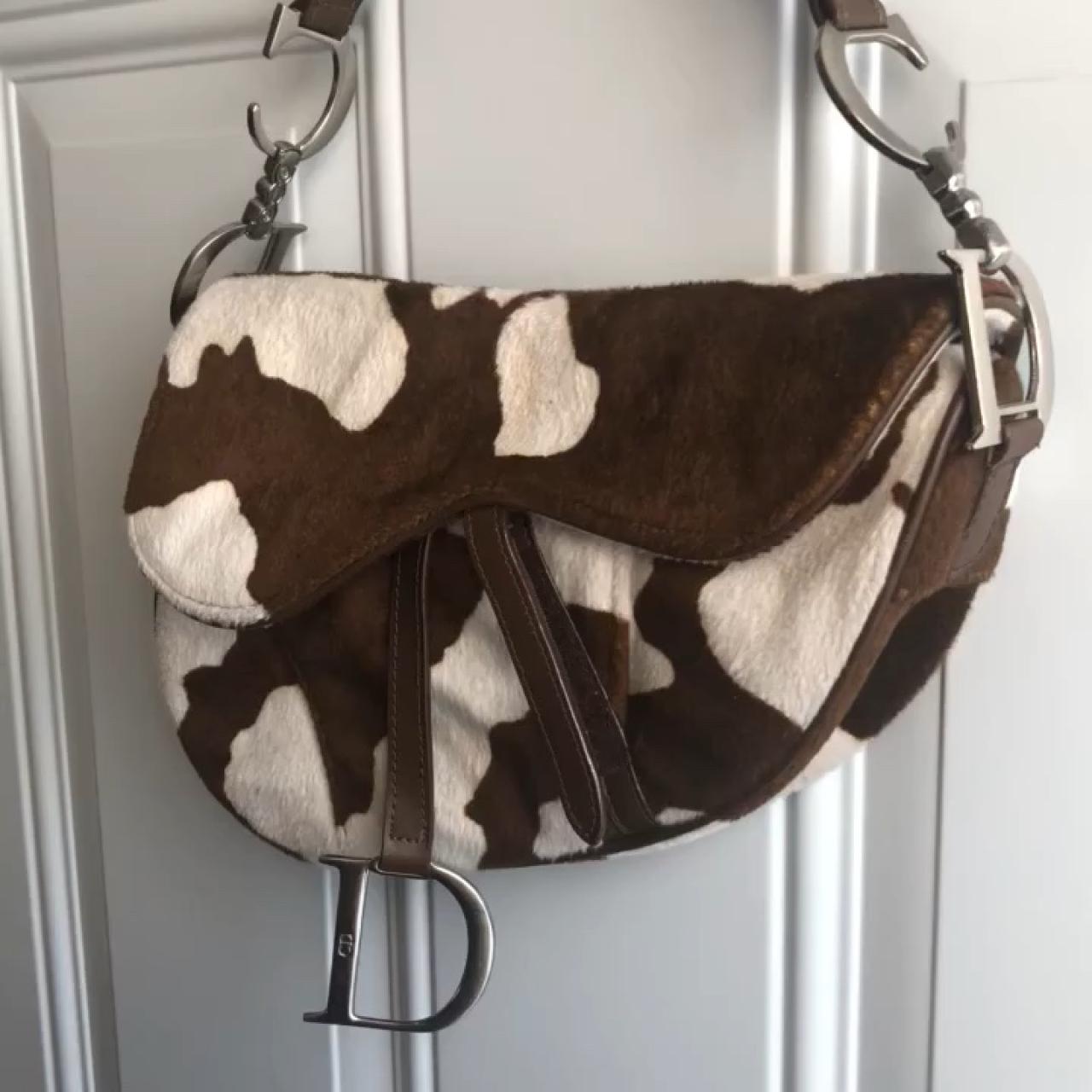 dior cow print saddle bag