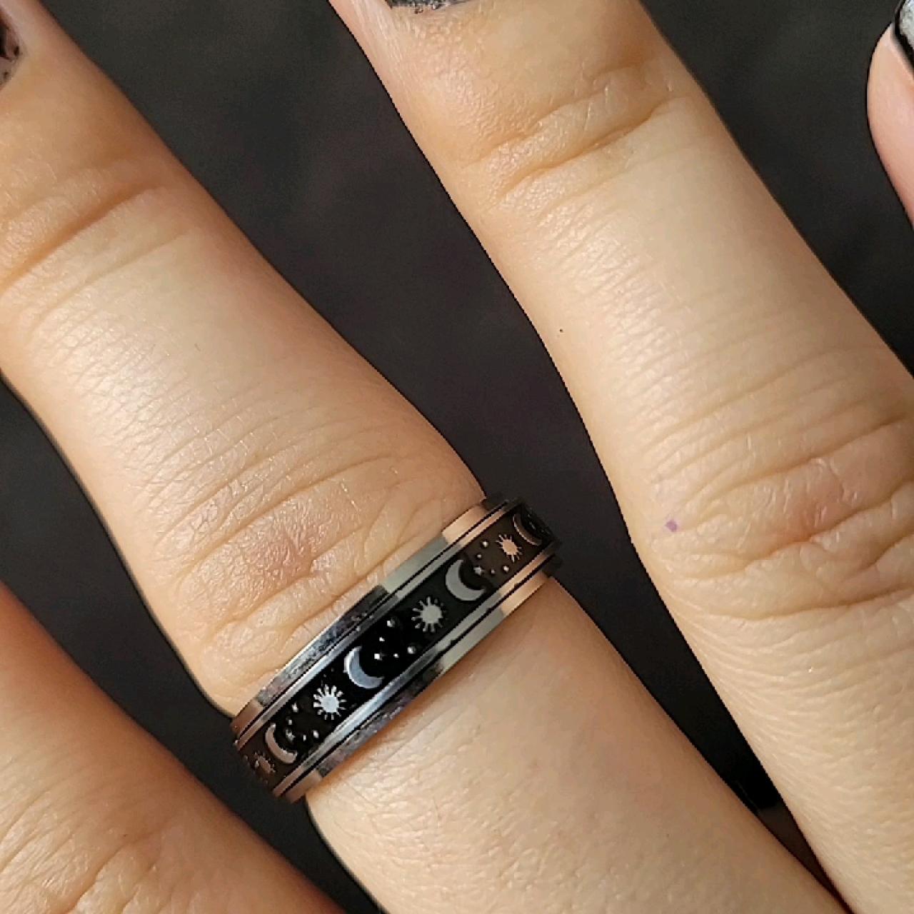 100 Brand New Stainless steel spinning ring. Black... Depop